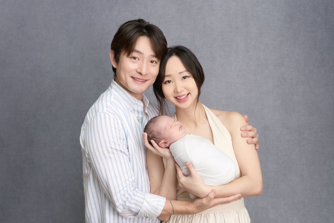 Ayden and Julia holding Louie.
